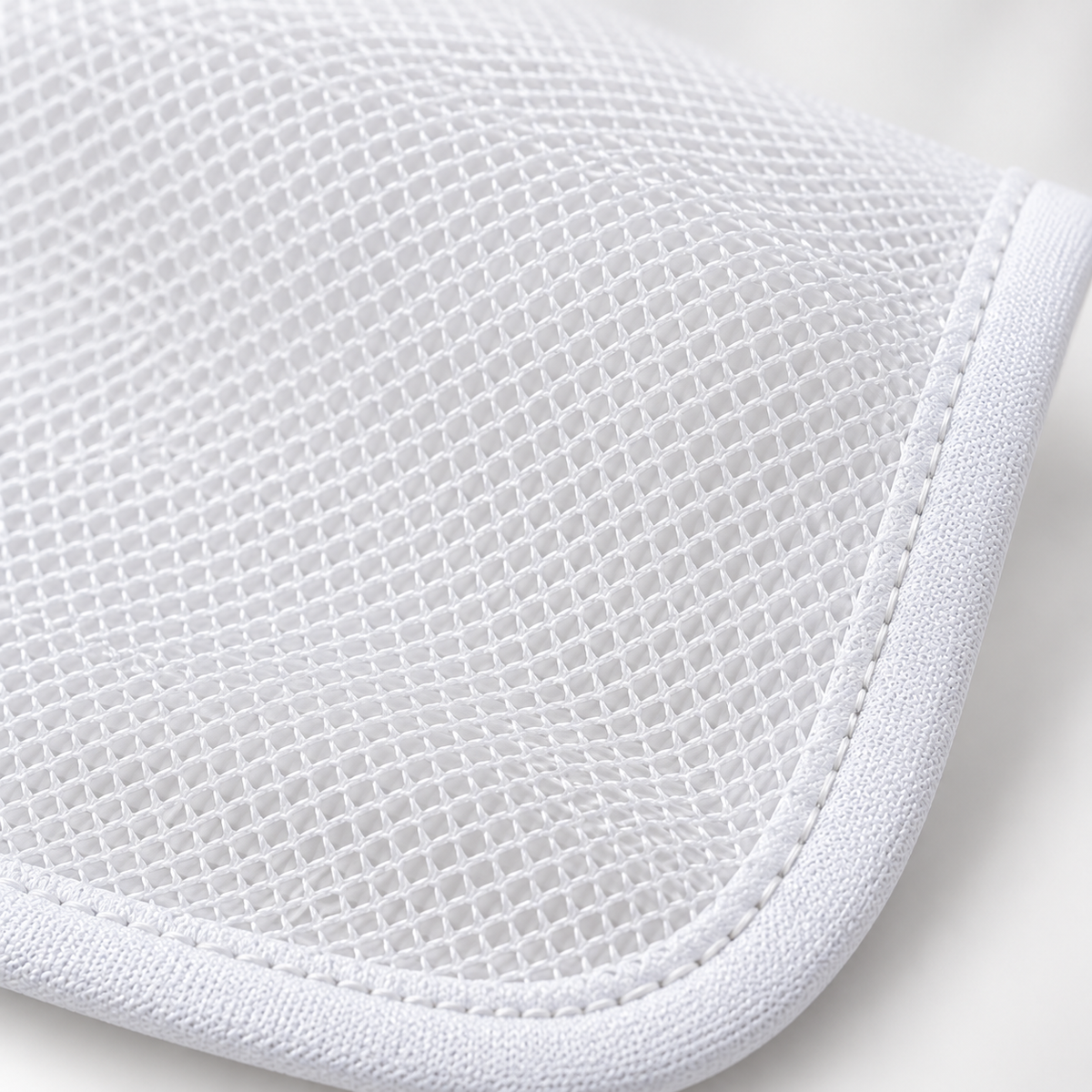 Close-up of polyester fine mesh and stitched edge
